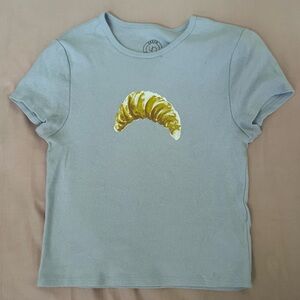 Urban Outfitters Pale Blue Short Sleeve Tee with Yellow Croissant Graphic